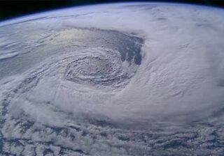 Satellite imagery captures low-pressure system driving heavy monsoon rain